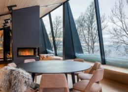 Hybrid house Aurora Lodge 2, large panoramic windows and a glowing fireplace