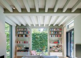Impressive exposed log beams in the living room ceiling