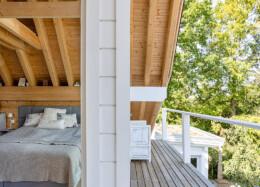 The bedroom opens onto a balcony