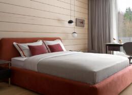 The cozy bedroom of the Polar log house