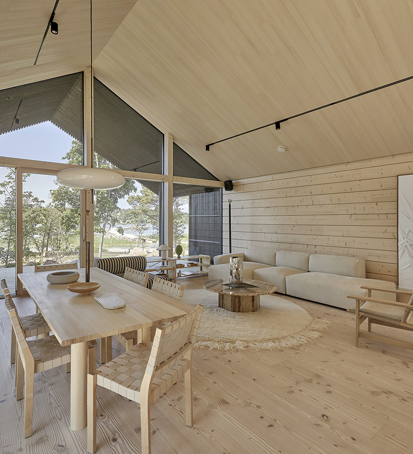 The modern log house Villa Havu is built using laminated spruce logs.