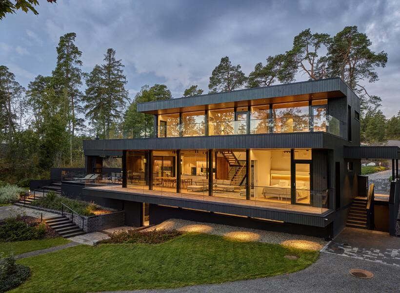 Villa Zee, a bespoke eco wooden house illuminated in the evening